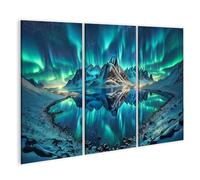 islandburner Tableau sur toile - Une superbe aurore boréale au-dessus des montagnes enneigées et un lac calme - 3 pièces