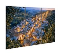 islandburner Tableau sur toile Village pittoresque au crépuscule dans des collines douces - 3 pièces