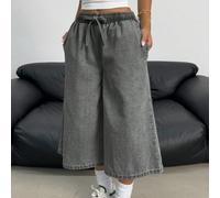 Jeans larges en denim stretch avec taille à cordon, style ample et délavé, pour adolescentes. Shorts en jean bohème d'été pour vacances. Tenues décontractées d'été pour concerts, festivals et raves. T