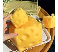 Jouet anti-stress en forme de fromage réaliste surdimensionné, balle de tofu malléable à rebond lent. Un jouet de bureau portatif qui peut soulager l'anxiété à tout moment, convient pour la salle de c