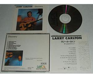 LARRY CARLTON. DISCOVERY. 1987 UNBARCODED 9 TRACK CD ALBUM MADE IN JAPAN. MCA 32XD-766.