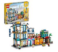 LEGO Jeu de construction La Grand-Rue 31141 – Gratte-ciel, rue de marché, hôtel, café, magasins