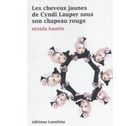 Les cheveux jaunes de Cindy Lauper sous son chapeau rouge