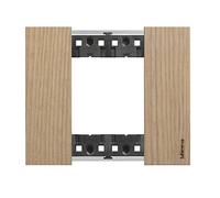 Living now, plaque montée sur la partie fonctionnelle de linterrupteur, tout comme les touches, pour lui apporter une finition esthétique