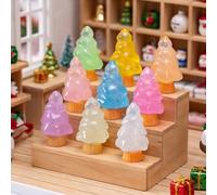 Lot de 5 mini sapins de Noël phosphorescents en résine Base orange | Cinq couronnes en résine translucide de couleurs mélangées brillent dans le noir sur des bases striées orange assorties de