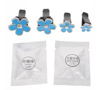 MALUGOGO Lot de 4 clips pour grille d'aération de voiture en forme de marguerite bleue en alliage avec tampons parfumés rechargeables, décoration de climatiseur de véhicule pour femme