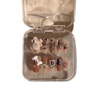 Manucure qui améliore le tempérament, explosions de patchs à ongles portés à la main par un ours ambre en automne et en hiver.(S)