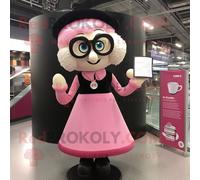 Mascotte Redbrokoly De Personnage Guinness Rose Habillé D'un Chemisier Et De Lunettes De Lecture Multicolore