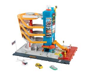 Matchbox Centre de Transport Coffret véhicules et jeu 5 étages, fonctions activées par les enfants et les voitures, inclut un taxi, un bateau et un hélicoptère à l’échelle 1/64, ainsi qu’un accessoire de restauration, HXL47
