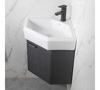 Meuble de salle de bain d'angle mural avec évier, petite baignoire à linge en céramique, robinet chaud et froid, design utilitaire peu encombrant pour salles de bains compactes.