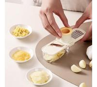 Mini coupe-ail multifonction avec récipient intégré, conçu pour trancher efficacement et réduire le désordre dans la préparation de l'ail et des légumes (vert)