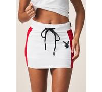 Mini-jupe avec panneaux latéraux contrastés, cordon de serrage à la taille, logo lapin, style athlétique streetwear. Tenue de jour de match de la Coupe du monde 2026, style sportif chic, maillot de fo
