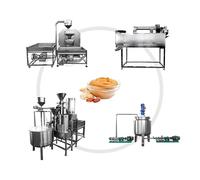 Moulin à beurre d'arachide commercial avec système de broyage à deux étapes pour faire des pâtes d'amande, de noix de cajou et de sésame lisses dans des environnements de production alimentaire de