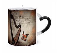 Mug thermosensible en céramique, motif harpe et papillons, à fond musical changeant de couleur. Idéal pour le thé, le chocolat chaud ou le lait. Un cadeau unique pour un anniversaire ou la Saint-Va
