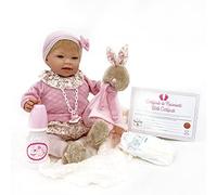 Nines Artesanals d'Onil - Poupée TITA Reborn.Elle Porte Un Ensemble en Tricot avec Un Chapeau Assorti, des Collants et des Chaussons en Fourrure. Elle est accompagnée d'un Doudou. Ces sont articulés.