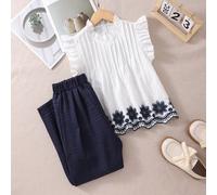 Nouveau Arrivage Ensemble Français 2 Pièces, Tenue d'été Décontractée ! Blouse blanche ajourée avec broderie et manches volantées, assortie à un pantalon droit à taille haute imprimé floral marine. Co