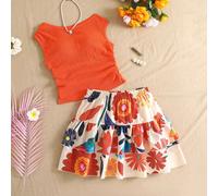 Nouveau style pour adolescentes, deux pièces. Élégant, décontracté et plein de l'esprit des vacances. Fabriqué en jacquard tricoté extensible, il comprend un pull sans manches col rond orange assorti 