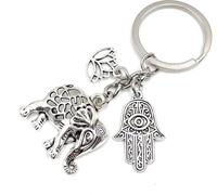 Onwomania Eléphant Fleur de Lotus Fatimas Porte-clés métal porte-bonheur dans boîte cadeau en alu, idéal pour offrir en cadeau