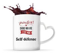 Otshirt Tasse Cœur Priorite N1 dans ma vie C'est mon Self-defense - Mug - Idée Tasse Personnalisable en forme de Cœur Cadeau Anniversaire Fête Original Famille Travail Départ Collègue Retraite Noël.