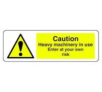 Panneau de sécurité autocollant « Caution Heavy Machinery In Use Enter At Your Own Risk » (600 mm x 200 mm) Distance de visualisation jusqu'à 14 m.