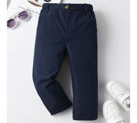 Pantalon de couleur unie décontracté pour jeune garçon, avec un seul bouton décoratif, poches en biais, design de taille élastique, convient pour le port quotidien, les voyages, les fêtes, les vacance