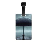 Parapluie noir dans les étiquettes de bagage de pluie, élégantes, imperméables et durables, assurez-vous que votre voyage est sûr et ordonné.