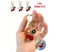 Pendentif cerise de haute qualité et mignon en or, Charm de sac rond noir mignon, Pendentif en alliage Lettre A-Z, Pendentif de sac à dos en forme de cerise, Porte-clés, Pendentif d'écouteur, Décorati