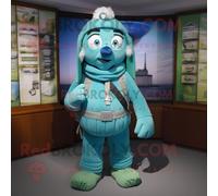 Personnage De Costume De Mascotte Redbrokoly Cyan Guinness Habillé D'un Short Cargo Et De Clips D'écharpe Multicolore