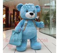 Personnage De Costume De Mascotte Redbrokoly Cyan Teddy Bear Habillé Avec Un Jean Skinny Et Des Sacs Fourre-Tout Multicolore