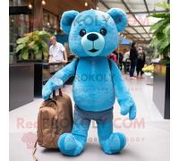 Personnage De Costume De Mascotte Redbrokoly Cyan Teddy Bear Habillé Avec Un Jean Skinny Et Des Sacs Fourre-Tout Multicolore