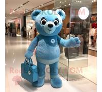 Personnage De Costume De Mascotte Redbrokoly Cyan Teddy Bear Habillé Avec Un Jean Skinny Et Des Sacs Fourre-Tout Multicolore