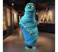 Personnage De Costume De Mascotte Redbrokoly De Momie Cyan Habillé D'une Robe De Cocktail Et D'épingles À Châle Multicolore