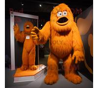 Personnage De Costume De Mascotte Redbrokoly De Sasquatch Orange Habillé D'un Combishort Et De Cravates Multicolore
