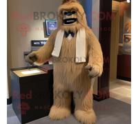 Personnage De Costume De Mascotte Redbrokoly Tan Sasquatch Habillé D'un Smoking Et D'écharpes Multicolore
