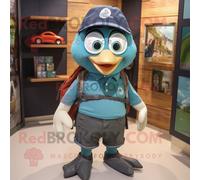 Personnage De Costume De Mascotte Redbrokoly Teal Guinness Habillé D'un Short En Jean Et De Sacs À Dos Multicolore