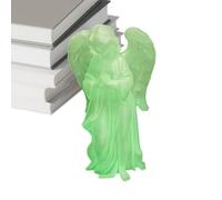 Petite figurine d'ange phosphorescente en train de prier