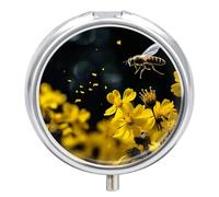 Pilulier rond avec motif abeilles qui volent au-dessus des fleurs
