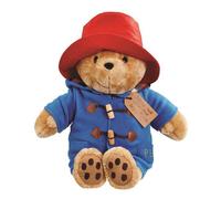 Portant son Duffel Coat traditionnel Ours Paddington doux et câlin assis