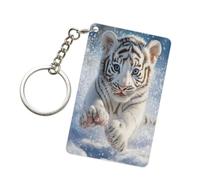 Porte-clés acrylique représentant un bébé tigre blanc jouant dans la neige. Accessoires tendance pour hommes et femmes.