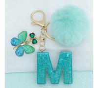 Porte-clés avec lettre pailletée, pompon moelleux et gland - accessoires de mode pour sac et e voiture, idéal pour les cadeaux de mariage, fête d'anniversaire. Décoration de sac charmante, porte-