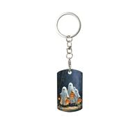 Porte-clés rectangulaire en métal plaqué représentant des citrouilles et de mignons fantômes empruntant un vieux chemin. Convient aux femmes et aux hommes.