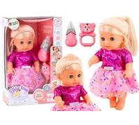 Poupée en robe rose fait pipi bouteille son