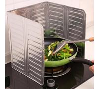 Protection d'huile flexible à charnière pour cuisinière à gaz qui maintient sa position pendant la cuisson et d'autres méthodes de cuisson actives