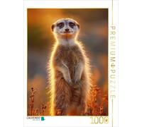 Puzzle CALVENDO Le suricate se tient dans le soleil couchant et regarde curieuse