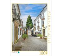Puzzle · Une Ruelle Tranquille à Ronda | Perchée sur un plateau rocheux, la pittoresque ville de Ronda… · 1000 pièces · Format assemblé 64 × 48 cm · CALVENDO Puzzle