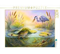 Puzzle · La Grenouille se Cache prudemment sous Les Feuilles de nénuphar | pour échapper au héron cendré · Une grenouille cherche refuge… · 1000 pièces · Format assemblé 64 × 48 cm · CALVENDO Puzzle