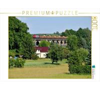 Puzzle · L'OHE 200086 tractant Un Train de Bois en ance de Löbau à | Demitz-Thumitz, le 8 juin 2016 · 1000 pièces · Format assemblé 64 × 48 cm · CALVENDO Puzzle