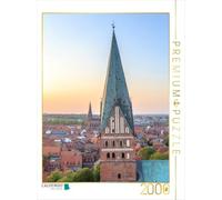 Puzzle · Vue sur Lunebourg et l'église Saint-Jean | L'église Saint-Jean au premier plan et l'église Saint-Nicolas à… · 2000 pièces · Format assemblé 90 × 67 cm · CALVENDO Puzzle