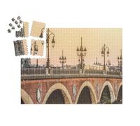 puzzleYOU : Smart Sorted® | Puzzle Photo 1000 pièces « Tramway sur Le Pont de Pierre avec l'église St Michel à Bordeaux au Coucher du Soleil »