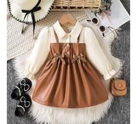 Robe A-line à manches bouffantes pour bébés filles. Coupe A-line classique convenant à différents types de morphologie de bébé. Le design distinctif du col ajoute une touche de formalité, tandis que l